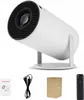A white projector is shown on a white background, with accessories like a manual, power cord, box, and remote control arranged below it. Produktbild-Vorschau