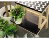 A close-up of a step stool with plants. Náhľad obrázku produktu