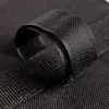 A close-up shot of a black fabric strap, possibly part of a pavilion weight or sandbag. Produktbild-Vorschau