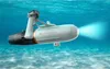 A white and black Aqua Marina BlueDrive X PRO Power Fin Tauchscooter und E-Motor is shown underwater with a blue light emanating from its front. Podgląd zdjęcia produktu