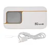 A white 5G mobile hotspot with a gray screen and gold accents, shown with a USB charging cable and a SIM card ejector tool. Podgląd zdjęcia produktu