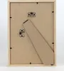 The back of a wooden picture frame with a stand attached. Produktbild-Vorschau
