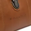 A close-up of a brown leather bag with embossed branding. Podgląd zdjęcia produktu