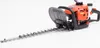 A hedge trimmer is shown against a white background. Náhľad obrázku produktu