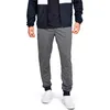 A person wearing Under Armour joggers and a jacket. Produktbild-Vorschau