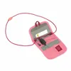 An open pink pouch with a lanyard and a key attached. Voir les images du produit
