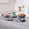 A countertop in a kitchen setting with a Ninja CRISPi air fryer and two glass containers filled with food. Anteprima dell’immagine prodotto