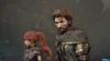 Two characters, a man and a woman, are shown in a close-up shot. The man is in the foreground, looking down with a serious expression. The woman is in the background, looking to the side. They appear to be in a fantasy or adventure setting, possibly from a Produktbild-Vorschau