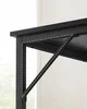 Close-up of the underside of a black desk, showing a metal support bracket. Náhled obrázku produktu