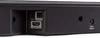 A close-up view of the back panel of a black soundbar, showing various input and output ports. Produktbild-Vorschau