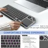 A person's hands are using a wireless keyboard with a trackpad, positioned next to a laptop. Produktbild-Vorschau