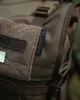 A close-up view of a backpack, focusing on the brand label and fabric texture. Produktbild-Vorschau
