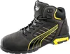 A black and yellow Puma safety boot is shown against a white background. Voir les images du produit