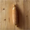 A smoked sausage net hangs on a wooden wall. Náhled obrázku produktu
