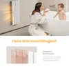 A woman and a baby in a bathroom setting, with a radiator visible. Anteprima dell’immagine prodotto