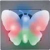 A close-up of a butterfly-shaped night light plugged into a wall socket. Produktbild-Vorschau