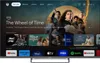 A smart TV screen displaying a streaming service interface with various content options and app icons. Náhľad obrázku produktu