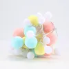 A cluster of colorful pom-pom string lights on a white background. Náhľad obrázku produktu