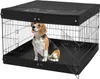 A beagle dog sits inside a black metal dog crate with a black cover on top. Voir les images du produit