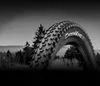 A close-up of a bicycle tire in a natural outdoor setting. Náhled obrázku produktu