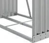 A close-up view of the base and lower sides of a silver metal firewood rack, showing its corrugated metal panels and metal frame structure. Náhľad obrázku produktu