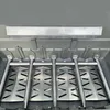Close-up view of the inside of a grill, showing the heat deflector and burners. Anteprima dell’immagine prodotto
