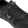 A close-up view of a black sneaker. Produktbild-Vorschau
