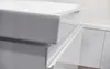 A close-up view of a white ceramic sink and a white cabinet in a bathroom. Produktbild-Vorschau