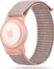 A pink Apple AirTag holder with a woven fabric strap, shown on a white background. Náhled obrázku produktu