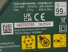 A close-up of a label on a product, showing technical specifications, safety symbols, and manufacturer information. Produktbild-Vorschau