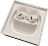 A pair of white wireless earbuds in their charging case, placed inside a white product box. Náhľad obrázku produktu