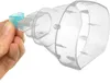 A hand holds a small blue cap attached to a clear plastic nebulizer mask. Voir les images du produit