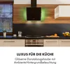 A modern kitchen scene featuring a black range hood with green ambient lighting above a stovetop and oven. Produktbild-Vorschau