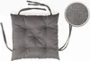 A single gray seat cushion with ties, shown flat against a white background. A magnified view of the fabric texture is in the upper right corner. Produktbild-Vorschau