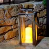 Lanterne solaire chic en bois naturel et inox effet bougie Voir les images du produit 3