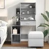 A vanity table with storage and a stool in a bedroom setting. Produktbild-Vorschau