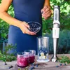 A person is preparing a smoothie with an immersion blender. Náhled obrázku produktu