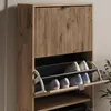 A close-up view of a wooden shoe cabinet with multiple flip-out drawers filled with shoes. Anteprima dell’immagine prodotto