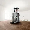 A silver Bosch kitchen machine with a blender attachment filled with strawberries and cream sits on a wooden countertop in a bright, modern kitchen. Anteprima dell’immagine prodotto