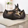 A dog is resting comfortably on a dark brown dog bed placed on a cream-colored rug. Produktbild-Vorschau