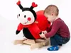 A young child is playing with a ladybug-themed rocking toy. Náhľad obrázku produktu