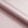 A close-up, angled view of a folded piece of pink fabric. Produktbild-Vorschau