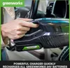 A person is holding a Greenworks cordless vacuum cleaner inside a car. Náhled obrázku produktu