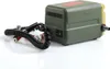 A green and yellow oil pump with black cables and red and black clamps is shown against a white background. Podgląd zdjęcia produktu