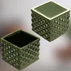 Two green ceramic planters with a diamond pattern. Produktbild-Vorschau