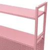 A close-up view of a pink shelf unit. Voir les images du produit