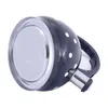 A black kettle with white polka dots shown from a low angle, highlighting its base and spout. Produktbild-Vorschau
