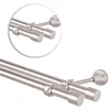 A close-up, angled view of a double curtain rod with end caps, mounted on a wall. Anteprima dell’immagine prodotto