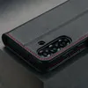 A close-up shot of a black leather phone case with red stitching, showing the camera cutout. Anteprima dell’immagine prodotto
