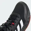 A close-up view of the toe box of a black Adidas sneaker with white stripes and red accents. Podgląd zdjęcia produktu